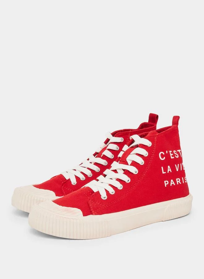 ستايلي حذاء سنيكرز كانفاس طويل مطبوع بشعار للرجال